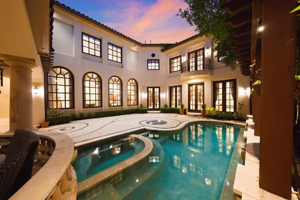 a front view of a house with swimming pool