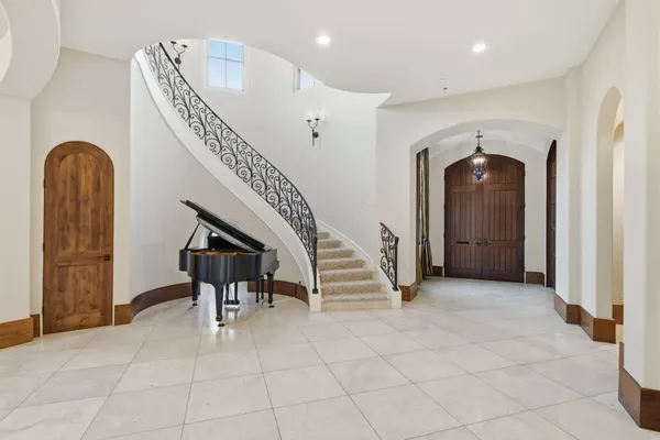 a view of entryway and hall with a front door