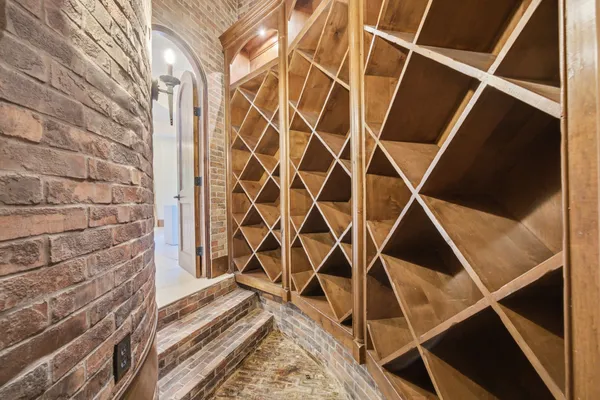 a kitchen with kitchen island granite countertop a sink stainless steel appliances and a counter top space