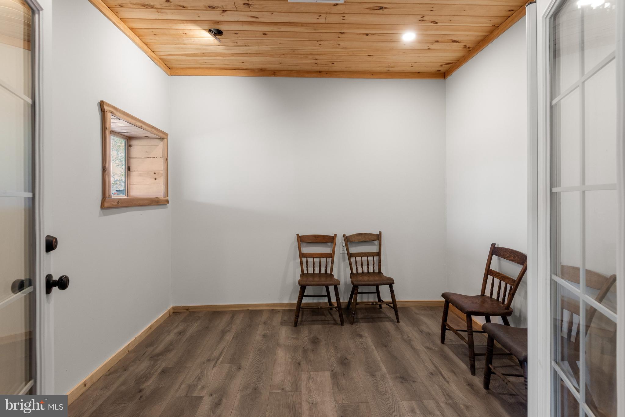 723 Saylors Mill Road Spring City, PA 19475 - Photo 66 of 74 a view of a room with wooden floor and lounge chair
