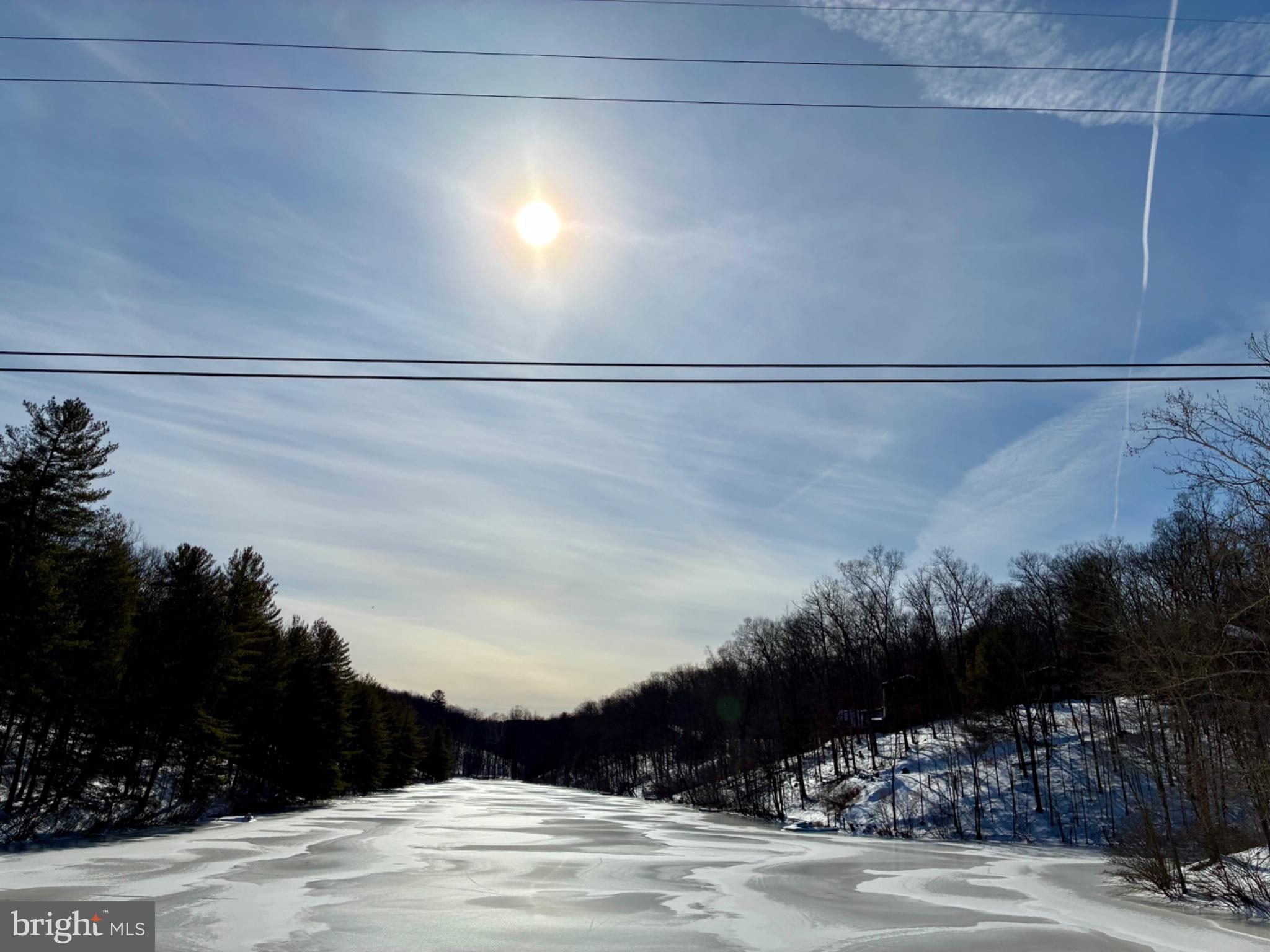 663 Audubon Road Hedgesville, WV 25427 - Photo 3 of 5 Winter's serene frozen landscape-community lake