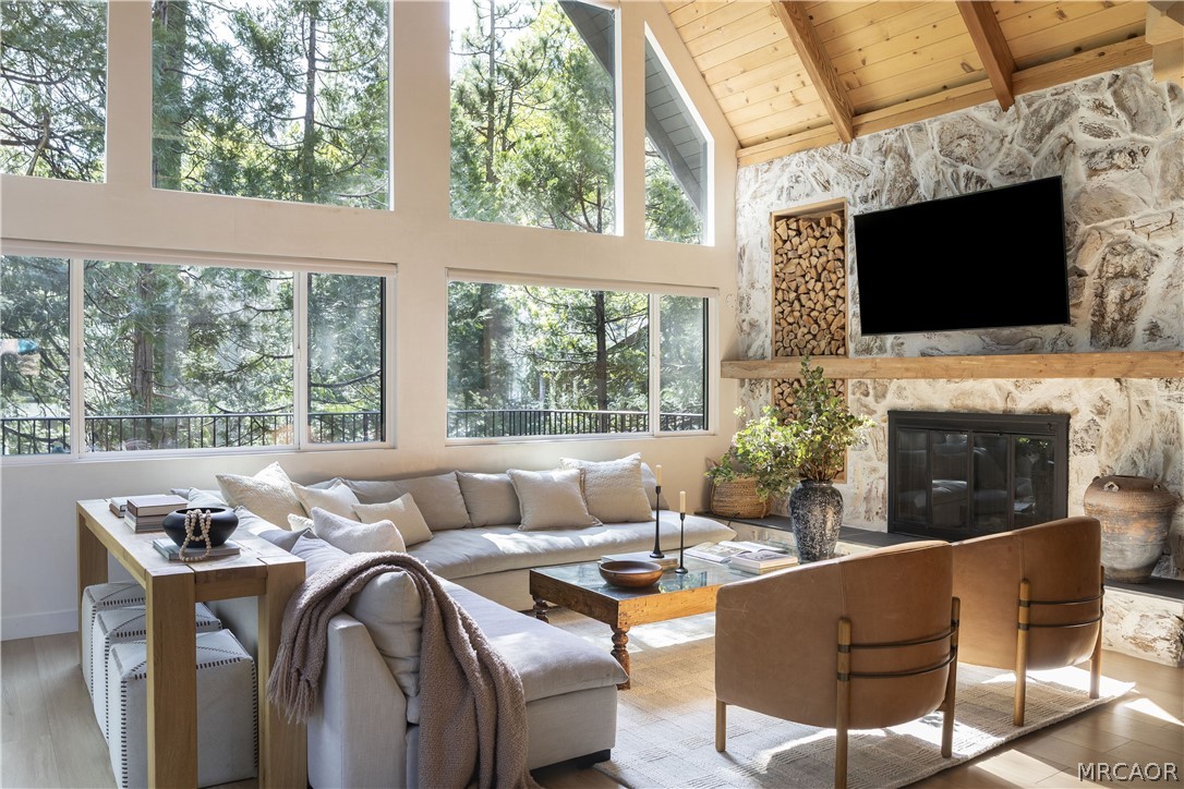 27643 West Shore Road, Unit 1 Lake Arrowhead, CA 92352 - Photo 2 of 28 a living room with furniture fireplace and large windows