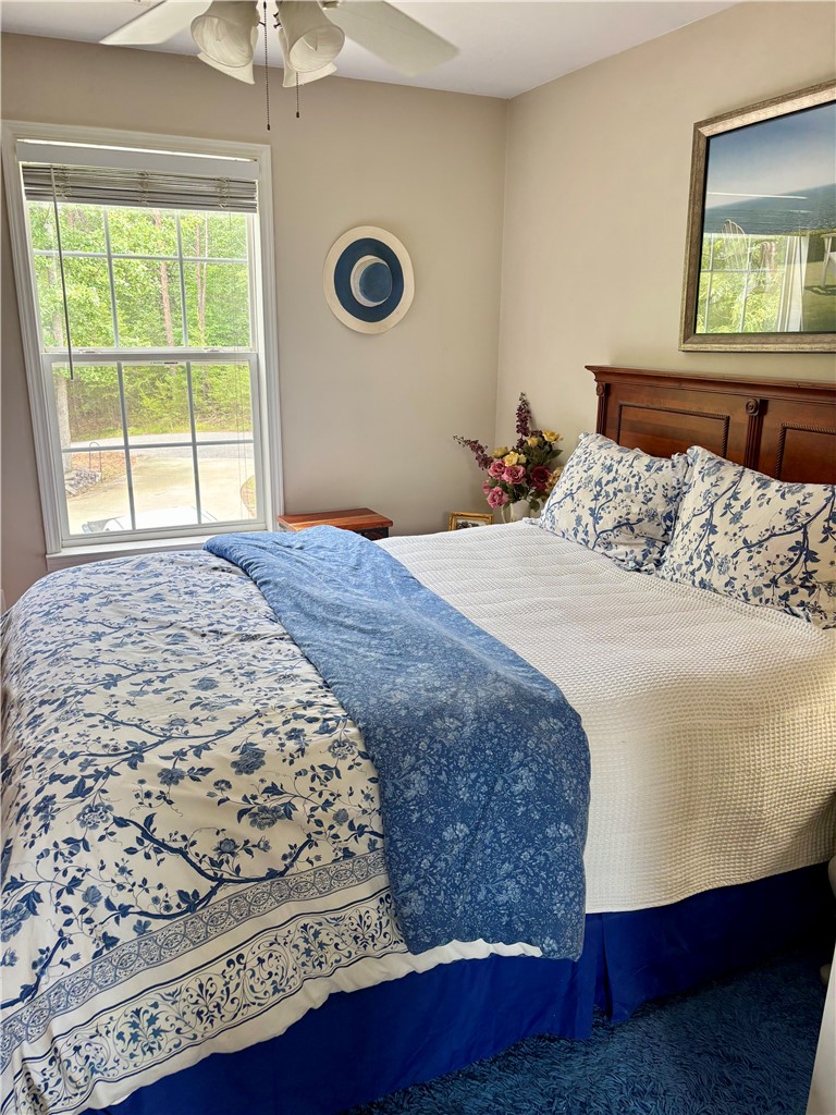 608 McKinney Way Westminster, SC 29693 - Photo 9 of 34 This bedroom provides comfort and a peaceful escape with views of nature.