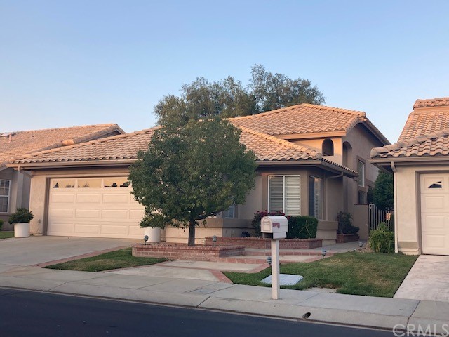 1222 Pine Valley Road Banning, CA 92220 - Photo 1 of 1 a front view of a house with garden