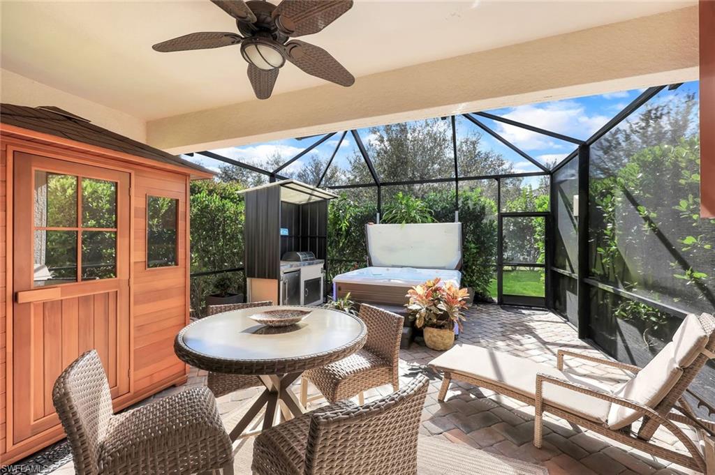 4244 Raffia Palm Circle Naples, FL 34119 - Photo 26 of 38 a outdoor view with a sitting space