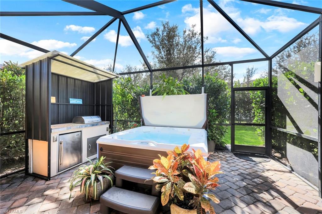 4244 Raffia Palm Circle Naples, FL 34119 - Photo 27 of 38 a outdoor space with a couch and chairs