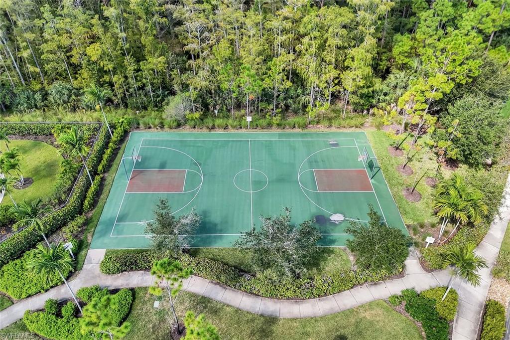 4244 Raffia Palm Circle Naples, FL 34119 - Photo 37 of 38 an aerial view of residential house with outdoor space and trees all around