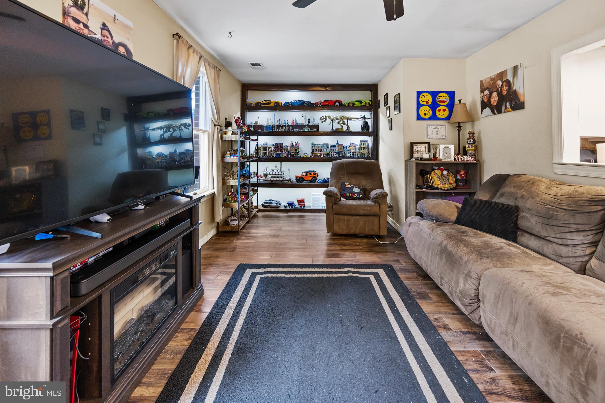 1715 Willow Place Clementon, NJ 08021 - Photo 16 of 37 a living room with furniture fireplace and a flat screen tv