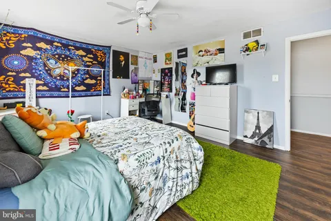 a bed room with a bed and a television