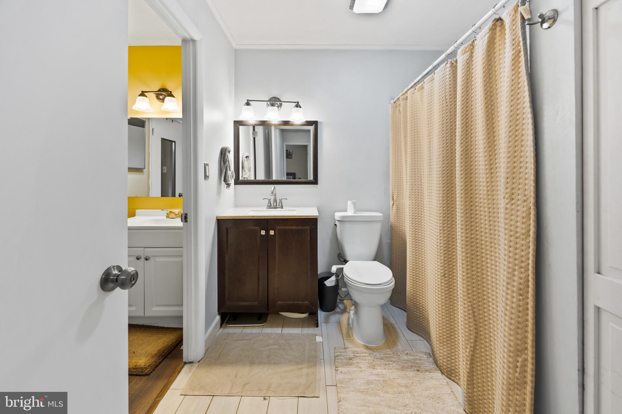 1715 Willow Place Clementon, NJ 08021 - Photo 30 of 37 a bathroom with a toilet sink and mirror