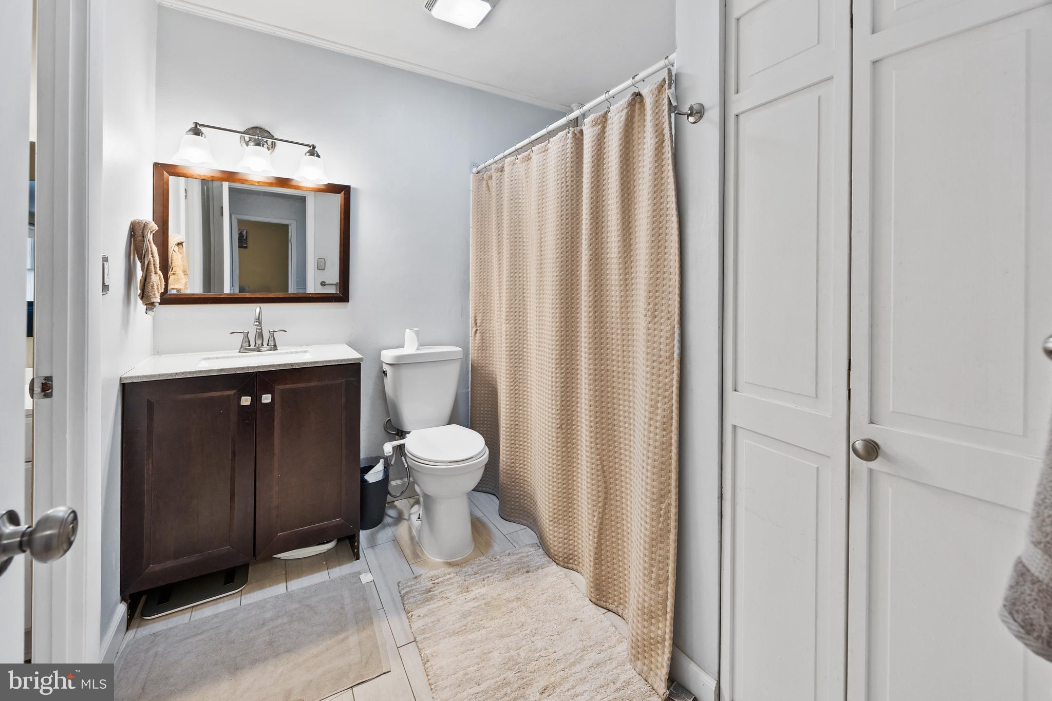 1715 Willow Place Clementon, NJ 08021 - Photo 31 of 37 a bathroom with a sink vanity mirror and toilet