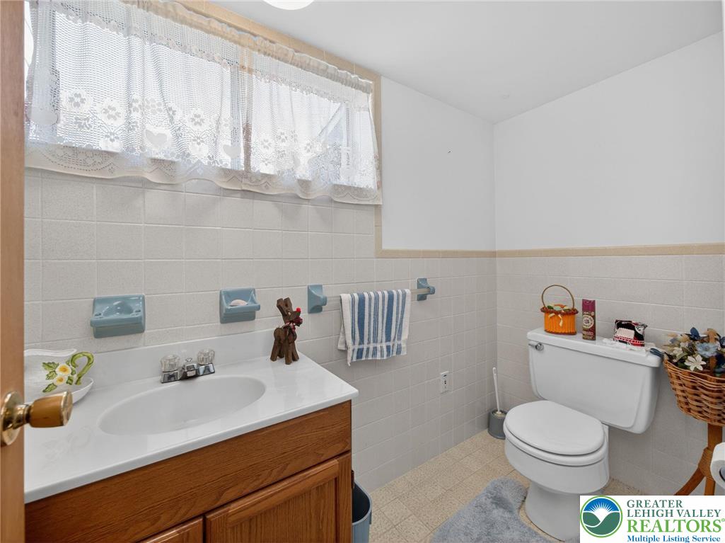 481 Forrest Avenue Bethlehem, PA 18017 - Photo 26 of 32 a bathroom with a sink a toilet and vanity