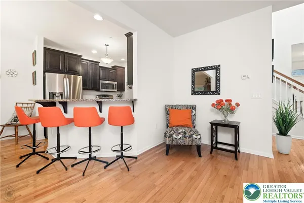 a kitchen with granite countertop a sink stove and cabinets