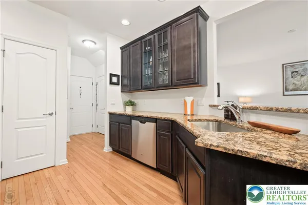 a bathroom with a shower sink and mirror