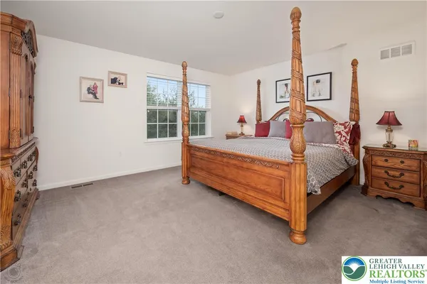 a bathroom with a double vanity sink toilet and shower