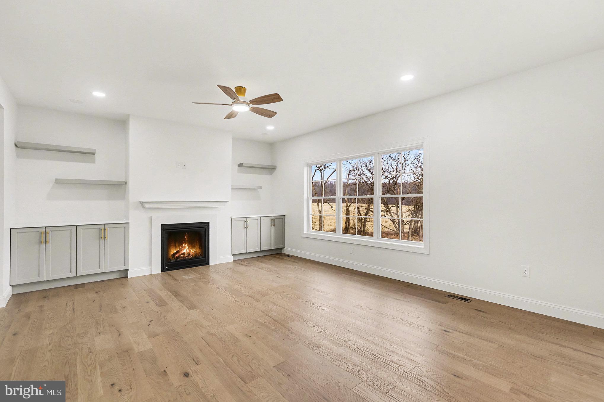1335 York Haven Road York Haven, PA 17370 - Photo 12 of 46 an empty room with windows and fireplace