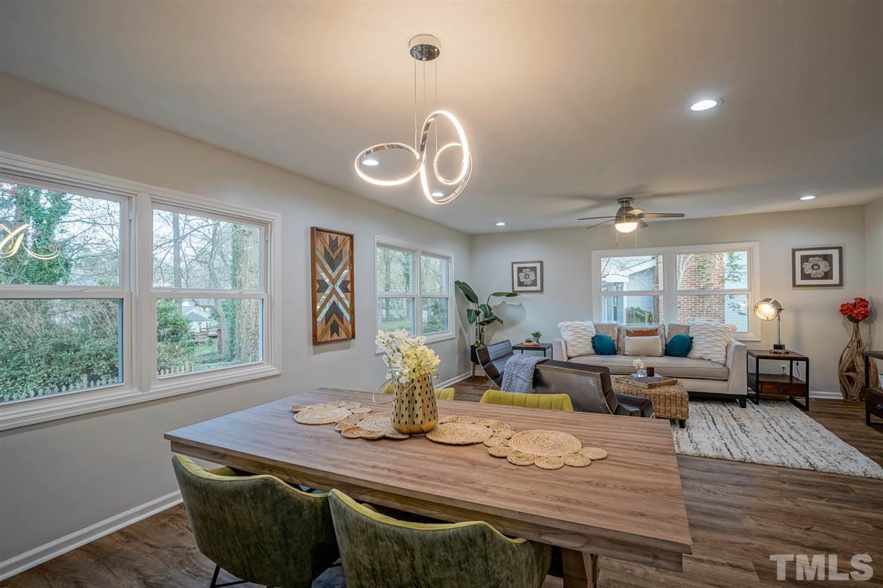 1105 Paddock Drive Raleigh, NC 27609 - Photo 14 of 30 a view of a dining room with furniture window and wooden floor