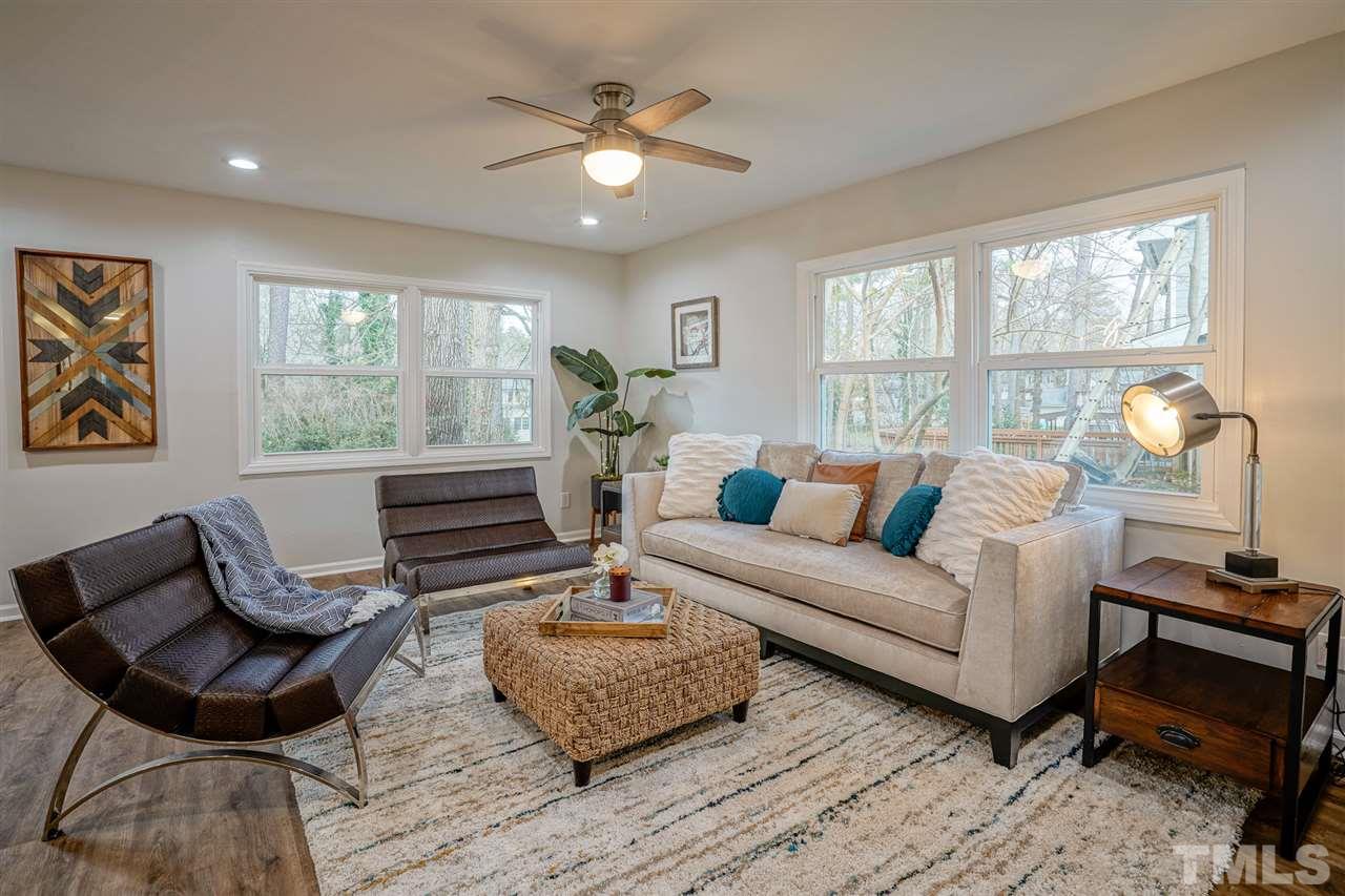 1105 Paddock Drive Raleigh, NC 27609 - Photo 16 of 30 a living room with furniture and a large window
