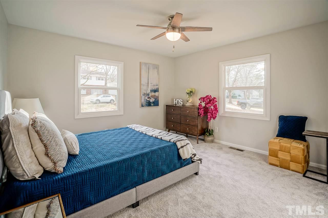 1105 Paddock Drive Raleigh, NC 27609 - Photo 26 of 30 a bedroom with a bed and window