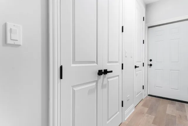 a view of a room with white walls