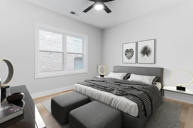 a bedroom with a bed and a couch