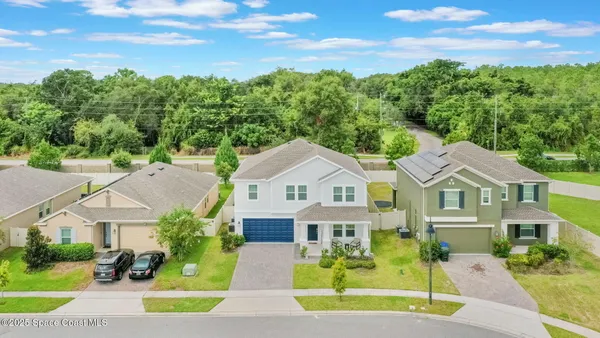 an aerial view of residential house with outdoor space and pool view