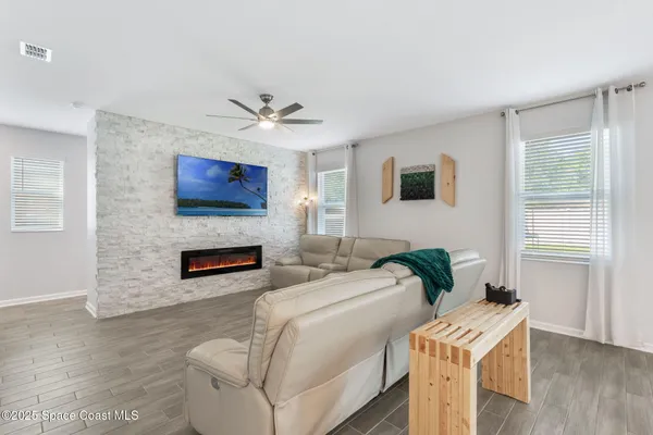 a living room with furniture and a large window