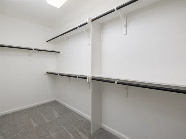 a view of an empty walk in closet