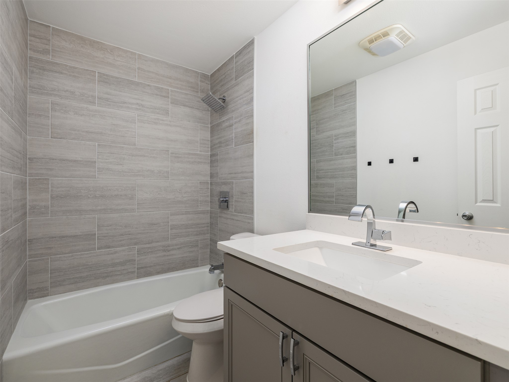 711 Buckingham Place Austin, TX 78745 - Photo 20 of 25 Bathroom featuring vanity and shower / washtub combination