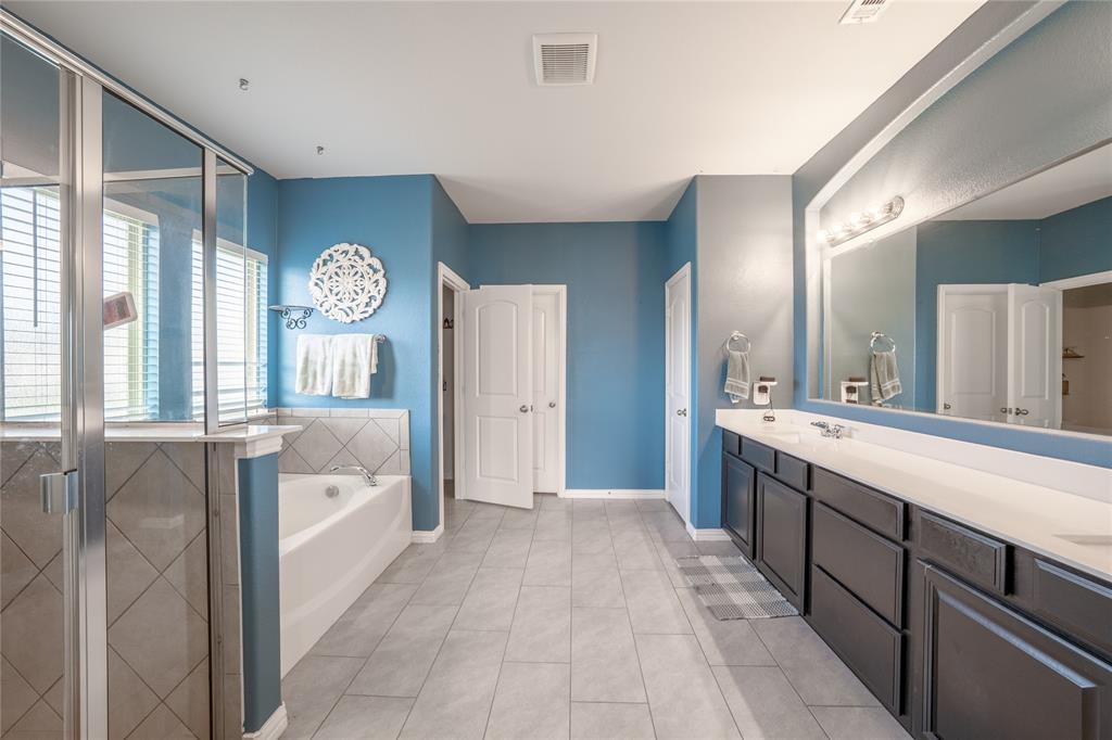 4542 Kipling Avenue Aubrey, TX 76227 - Photo 17 of 34 a large bathroom with a large tub and sink