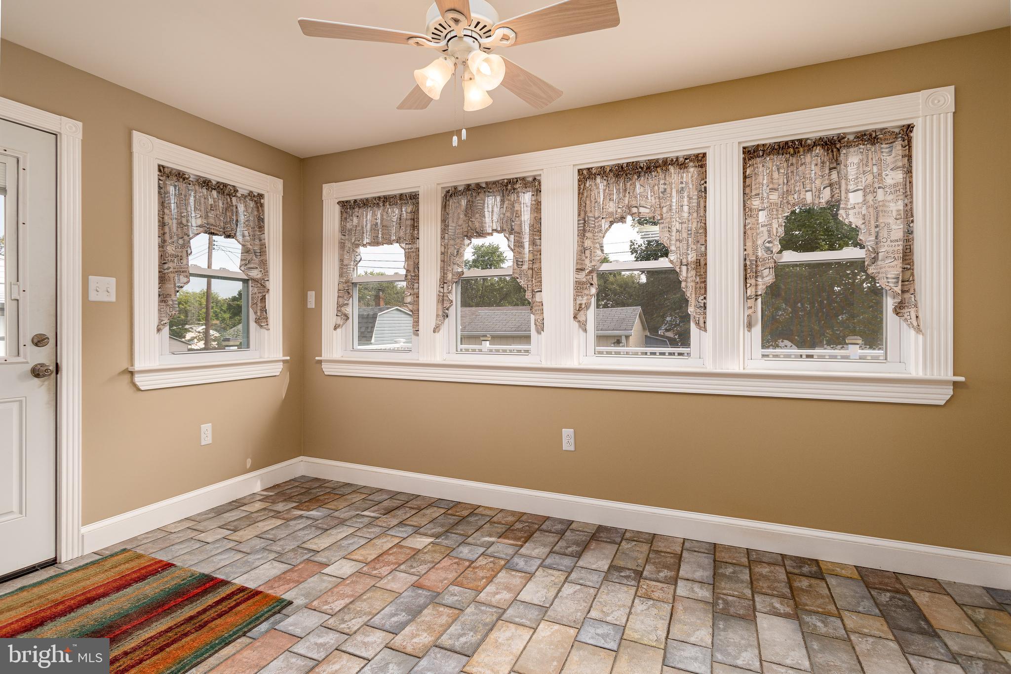 608 Rutledge Avenue Folsom, PA 19033 - Photo 8 of 28 Sun room with access to large deck and yard