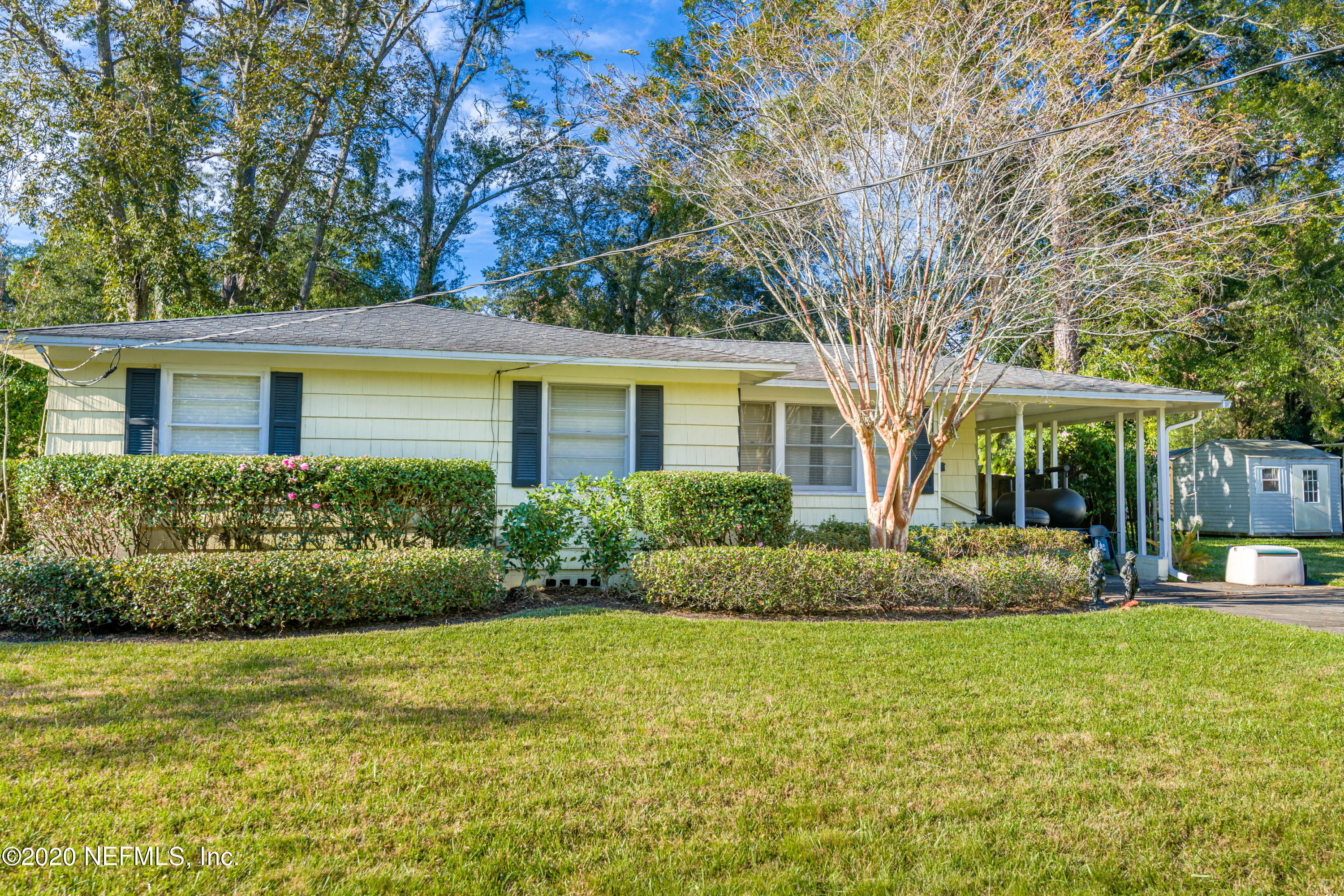4615 Homestead Road Jacksonville, FL 32210 - Photo 1 of 41 a front view of a house with garden