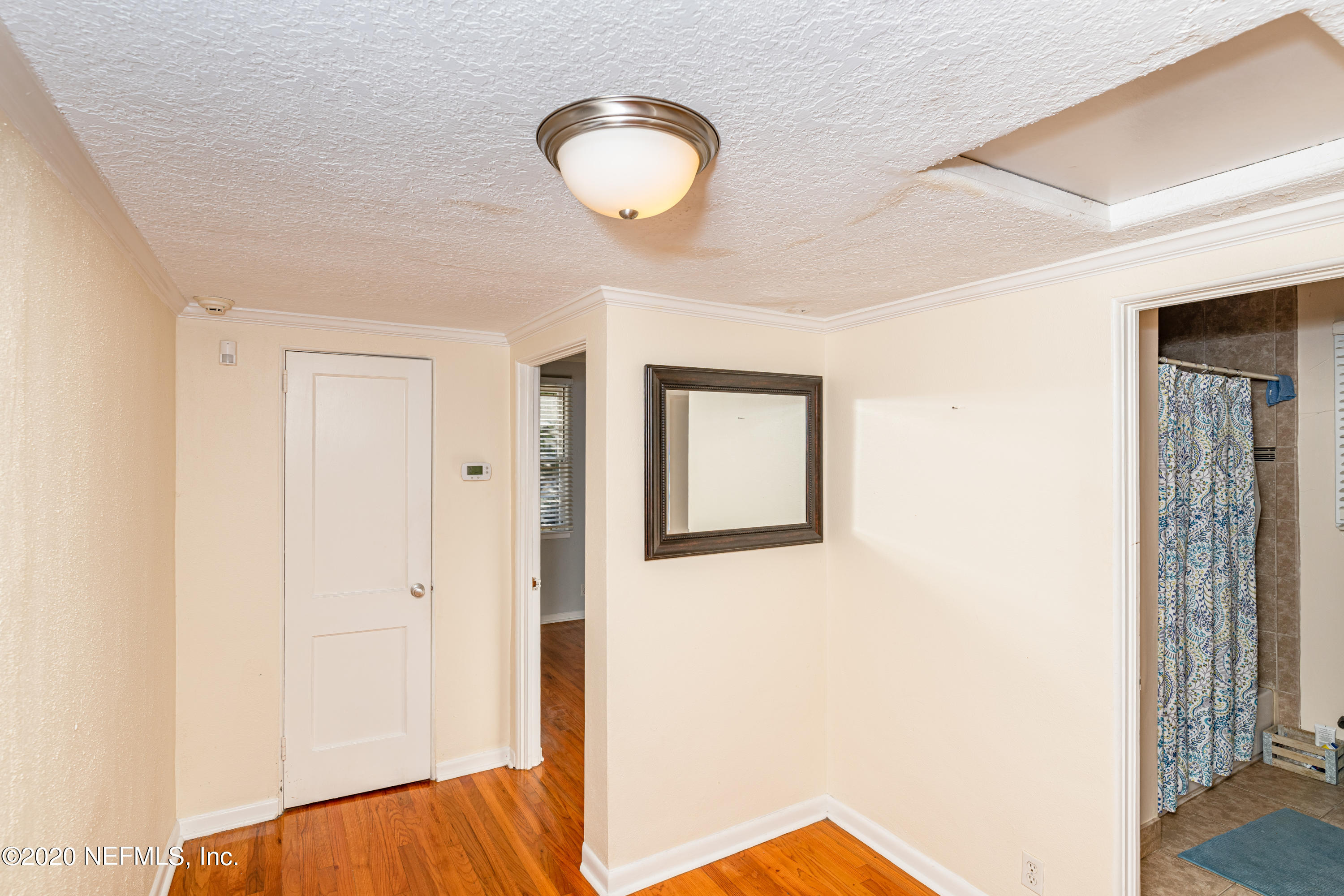 4615 Homestead Road Jacksonville, FL 32210 - Photo 15 of 41 a view of a room with wooden floor and entryway