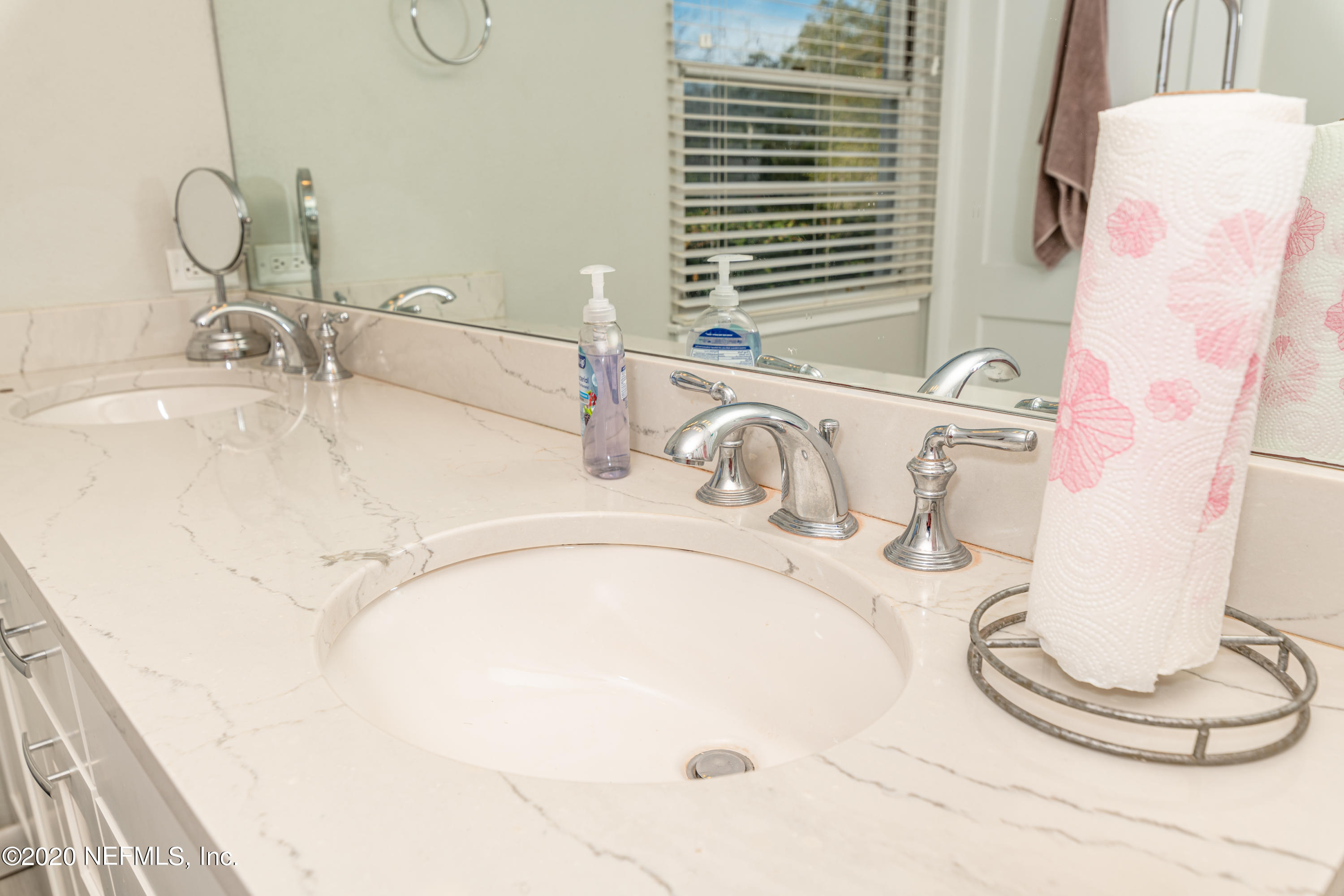 4615 Homestead Road Jacksonville, FL 32210 - Photo 21 of 41 a bathroom with a sink and a mirror