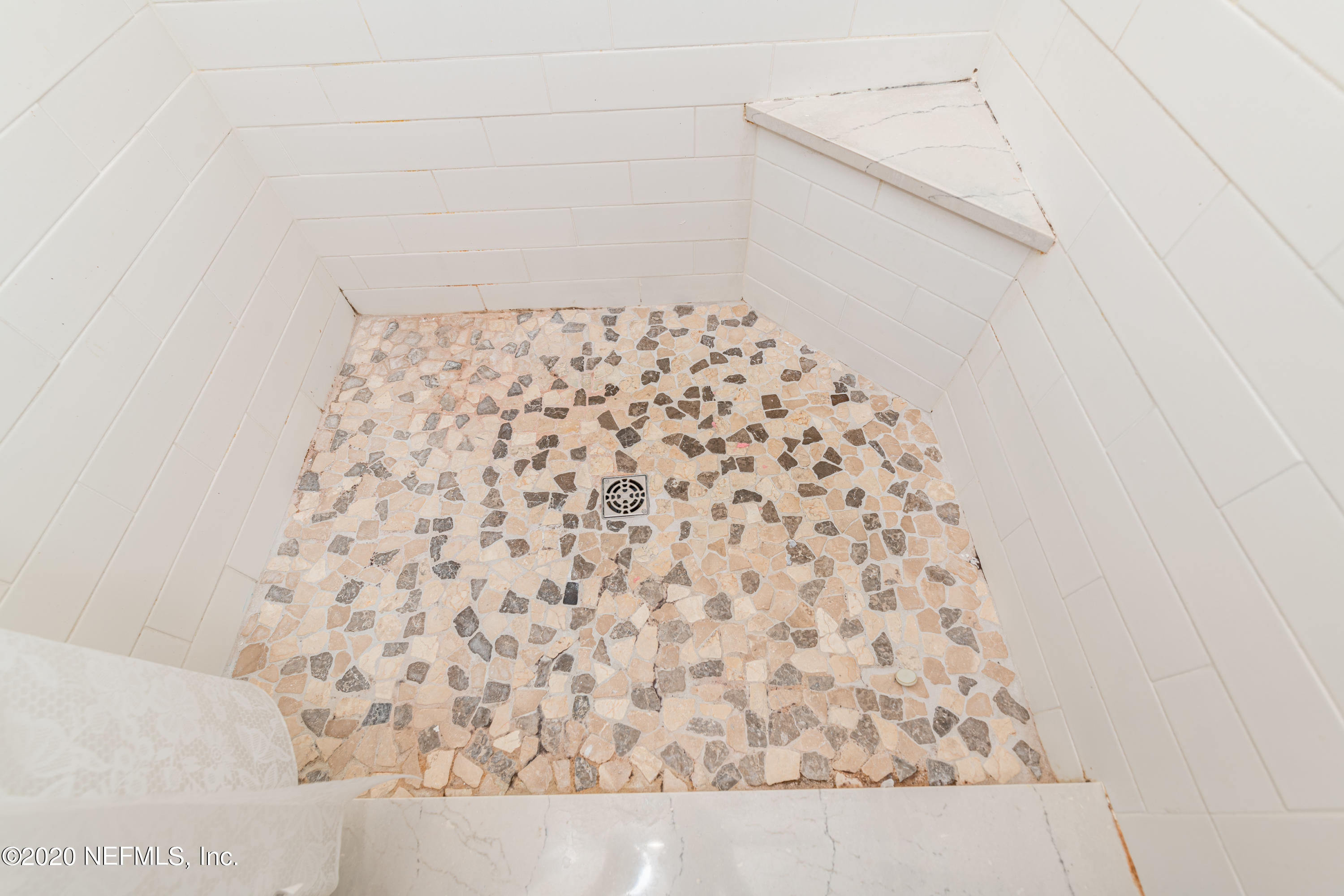 4615 Homestead Road Jacksonville, FL 32210 - Photo 23 of 41 a bathroom with a shower curtain
