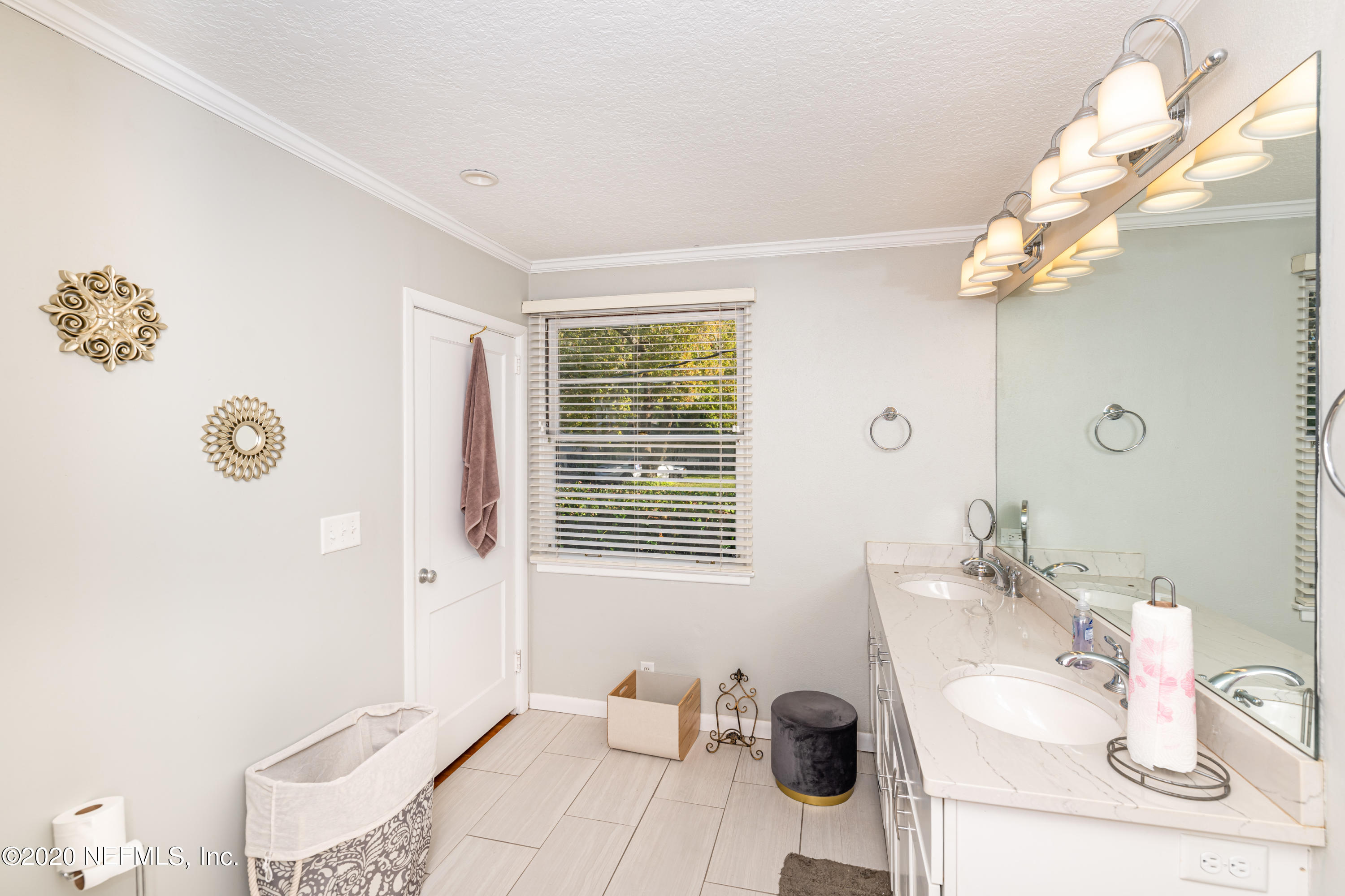 4615 Homestead Road Jacksonville, FL 32210 - Photo 24 of 41 a bathroom with a sink and a mirror