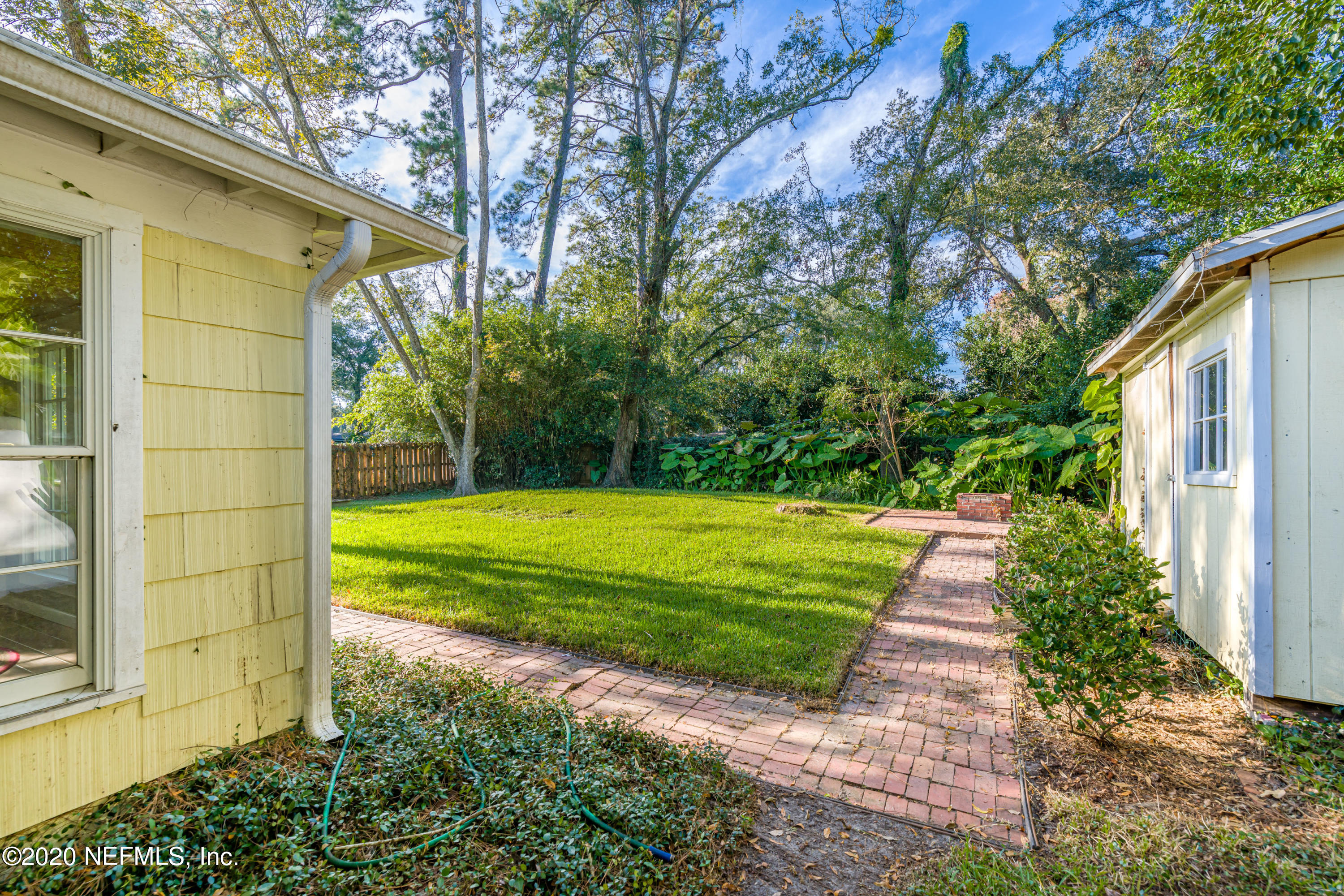 4615 Homestead Road Jacksonville, FL 32210 - Photo 30 of 41 a view of a house with a backyard