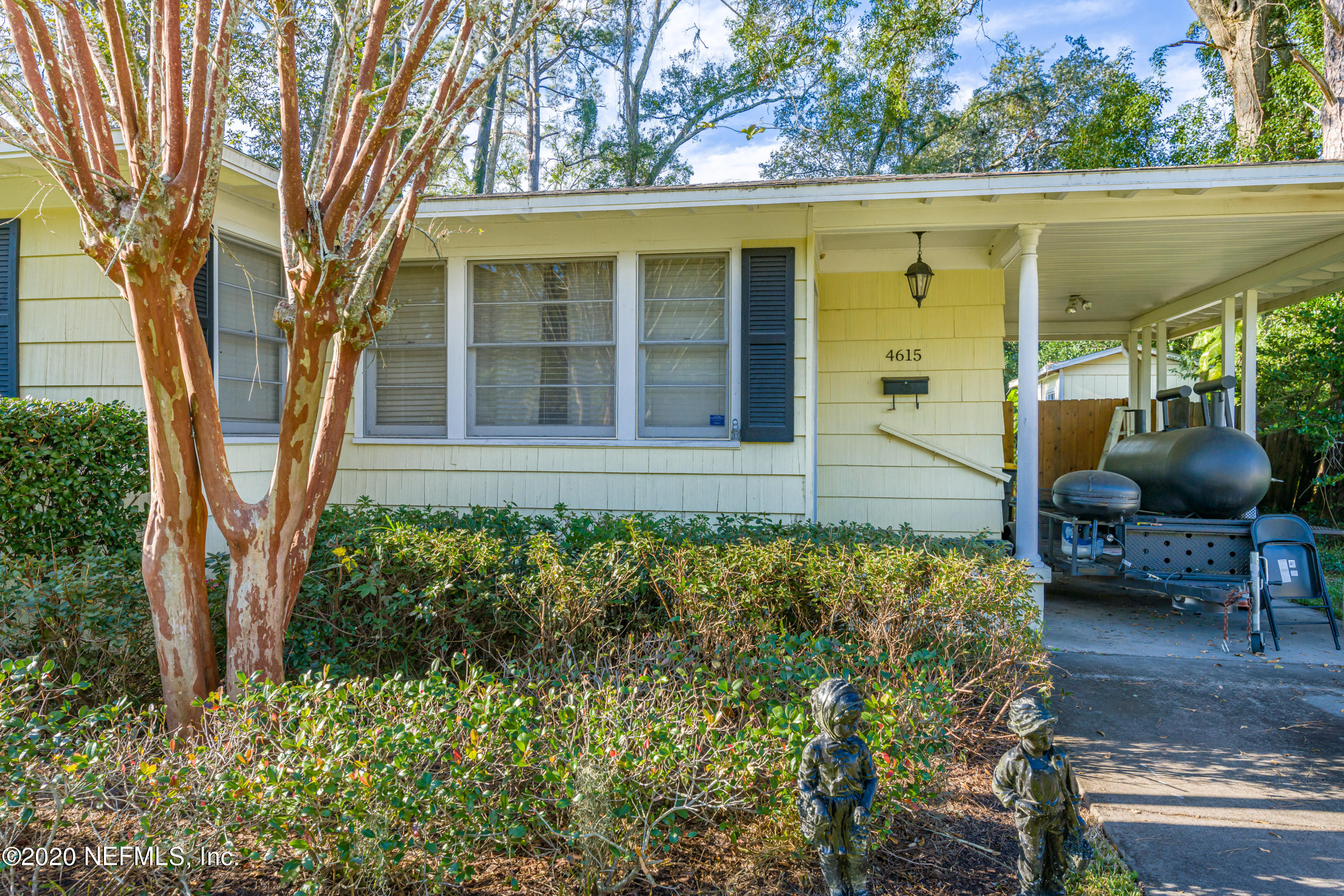 4615 Homestead Road Jacksonville, FL 32210 - Photo 3 of 41 front view of a house with a garden