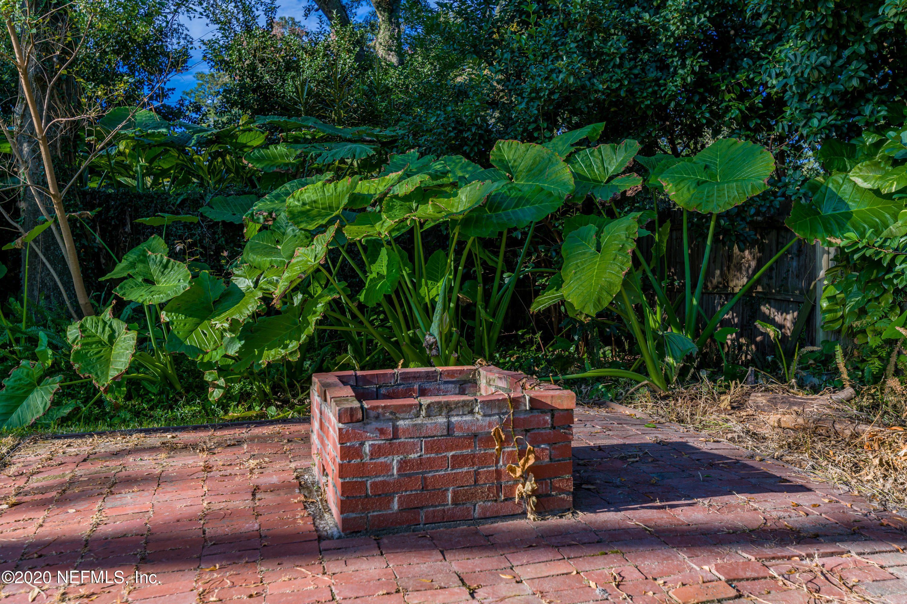 4615 Homestead Road Jacksonville, FL 32210 - Photo 32 of 41 a backyard of a house with lots of green space