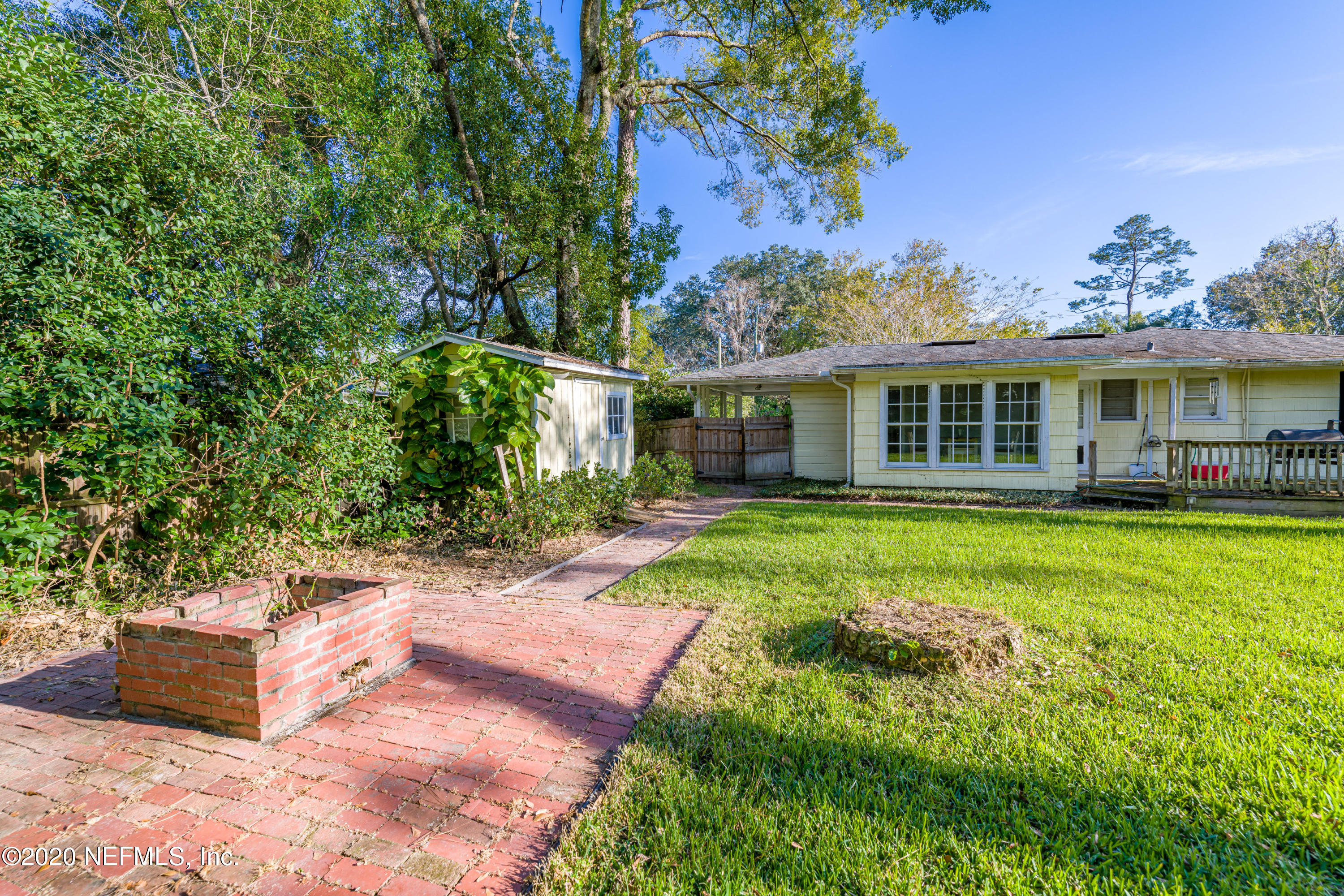4615 Homestead Road Jacksonville, FL 32210 - Photo 34 of 41 a view of a house with a backyard