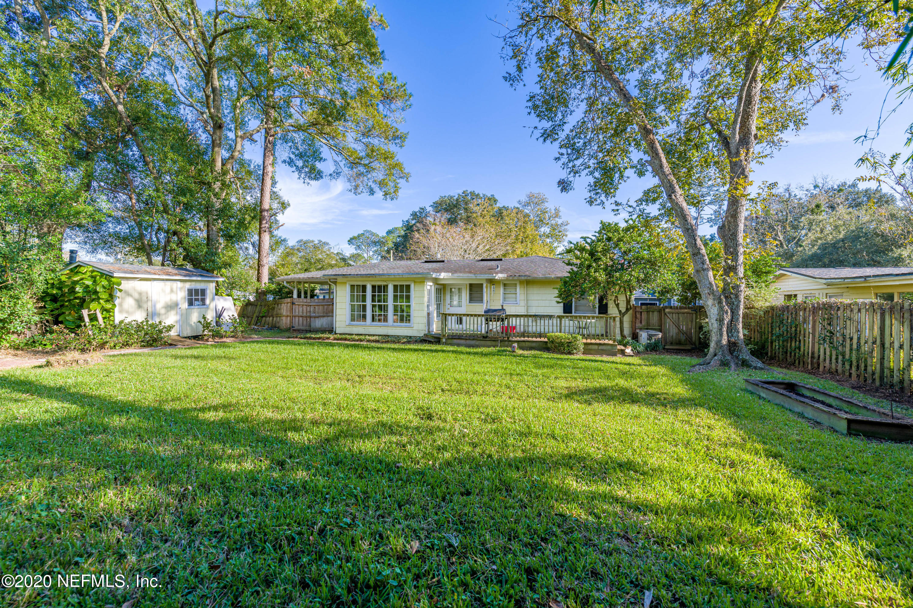 4615 Homestead Road Jacksonville, FL 32210 - Photo 36 of 41 a front view of a house with a yard