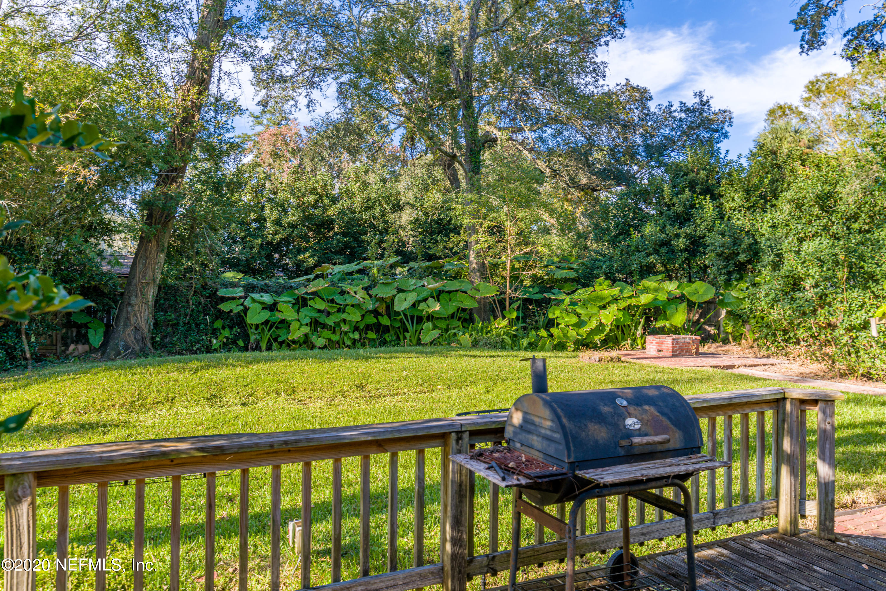 4615 Homestead Road Jacksonville, FL 32210 - Photo 39 of 41 a view of a swimming pool with a patio and a yard