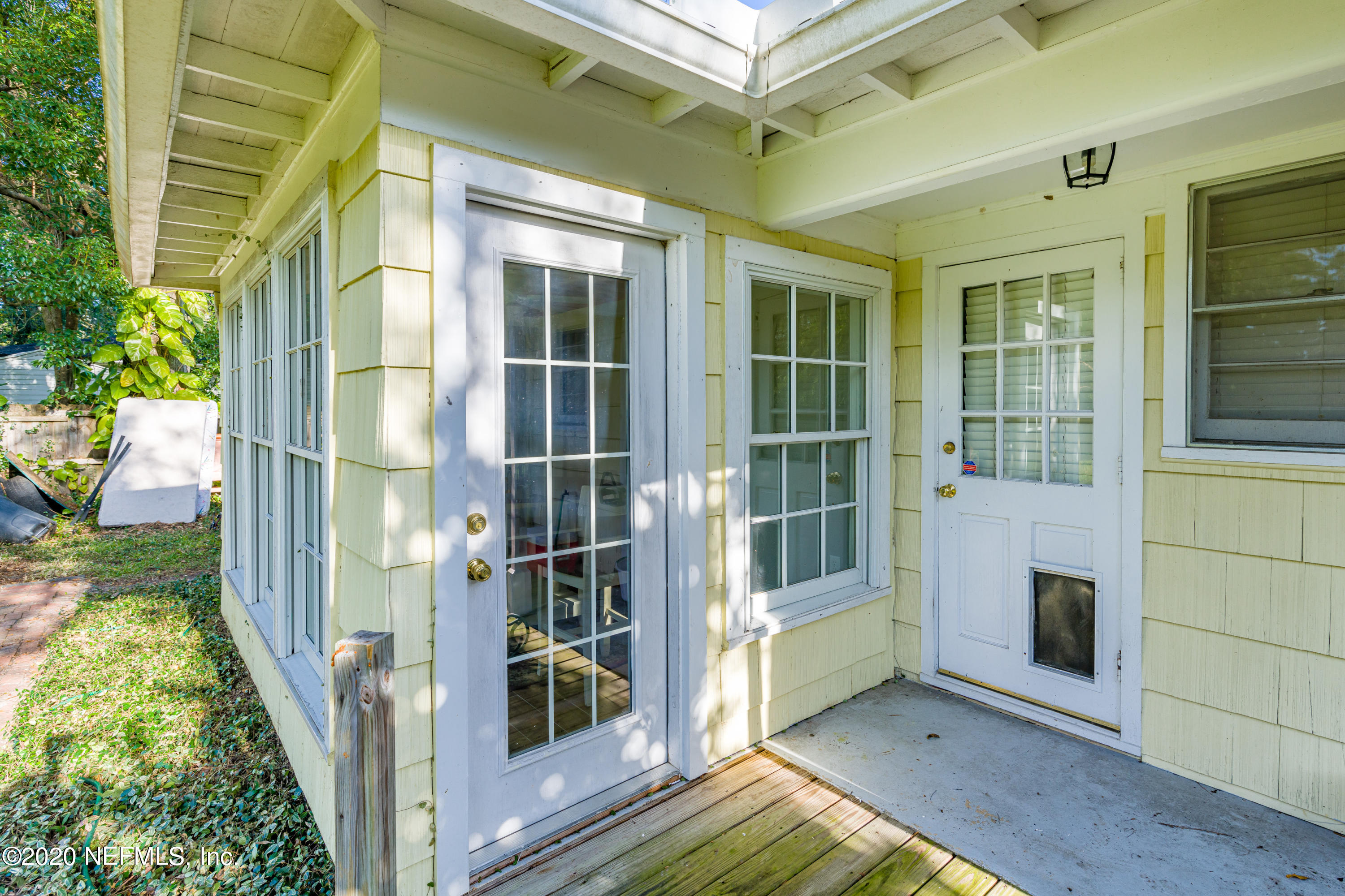 4615 Homestead Road Jacksonville, FL 32210 - Photo 40 of 41 a view of front door and porch with wooden floor