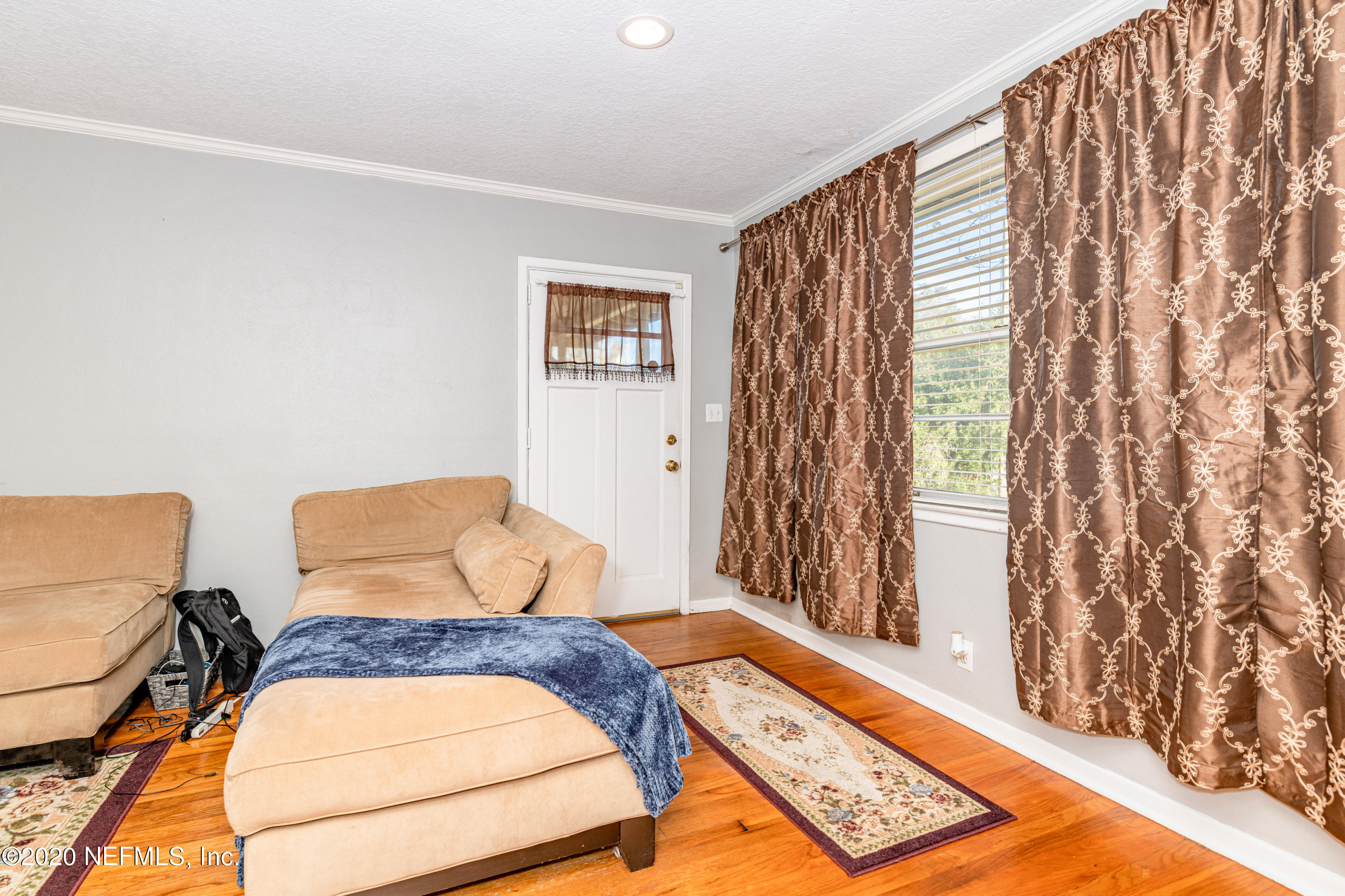 4615 Homestead Road Jacksonville, FL 32210 - Photo 7 of 41 a bedroom with a bed and a window