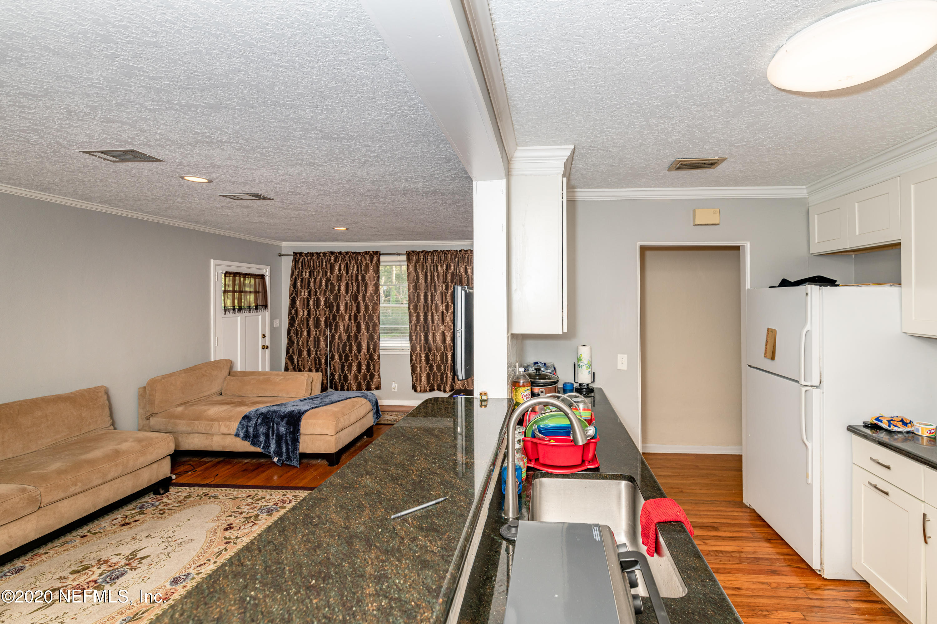 4615 Homestead Road Jacksonville, FL 32210 - Photo 10 of 41 a room with furniture and a couch