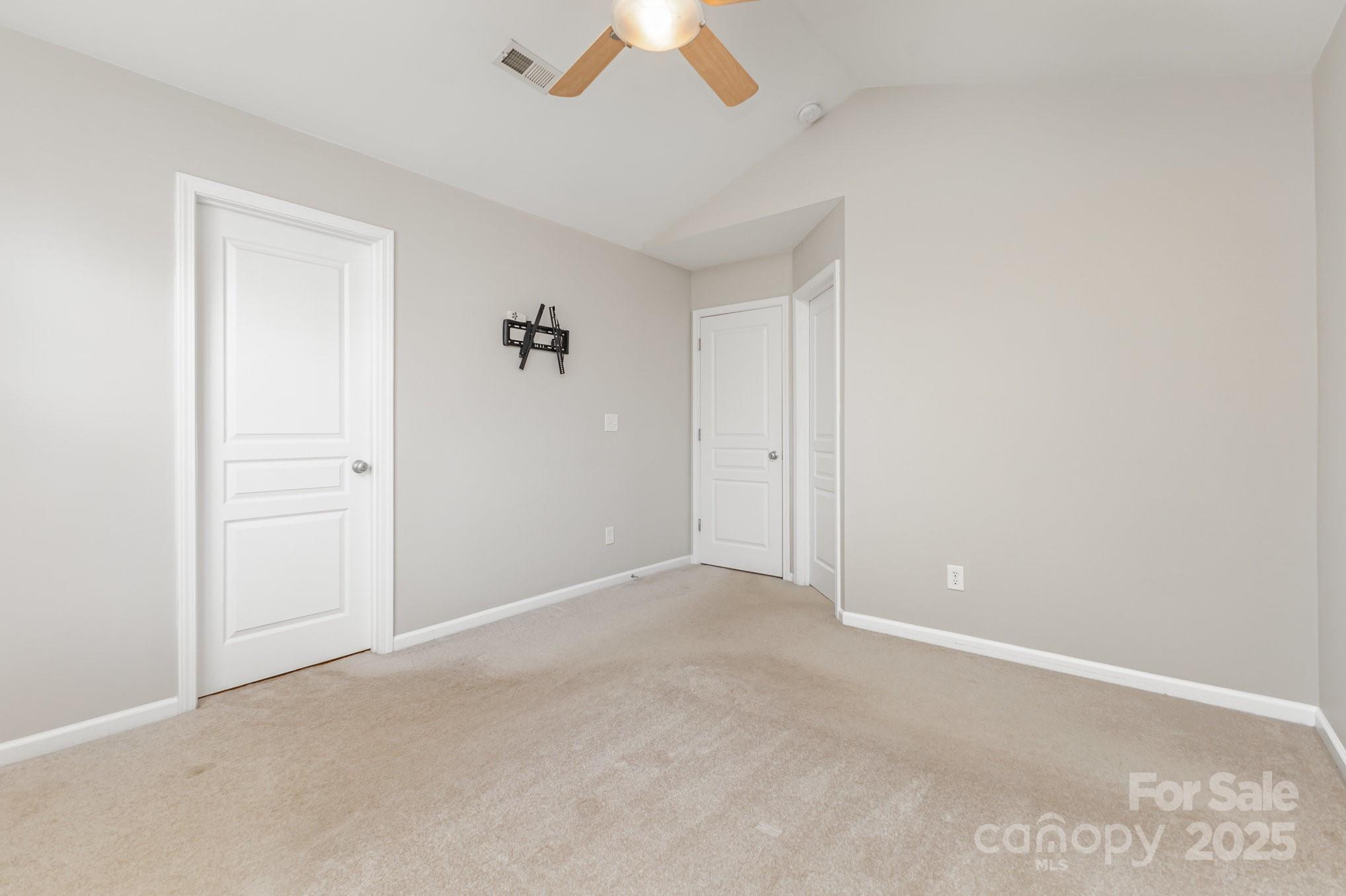 230 Dawn Mist Lane Fort Mill, SC 29708 - Photo 20 of 34 an empty room with a ceiling fan and a window