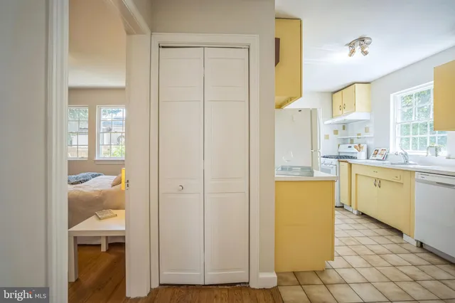 a kitchen with a refrigerator and cabinets