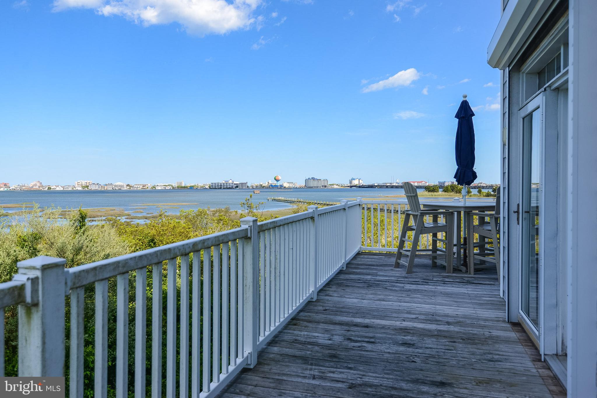 10050 Golf Course Road, Unit 27 Ocean City, MD 21842 - Photo 41 of 43 wrap around deck with hurricane shutters