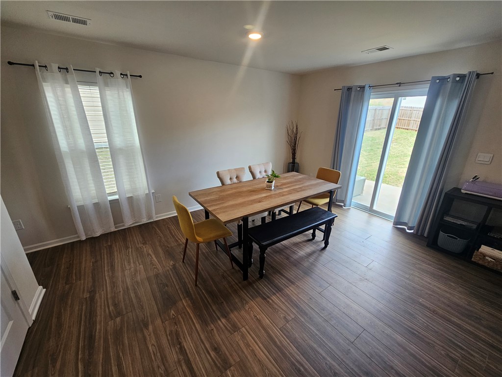 902 Ashwood Lane Easley, SC 29640 - Photo 11 of 39 Natural light floods this dining area, featuring attractive wood flooring.