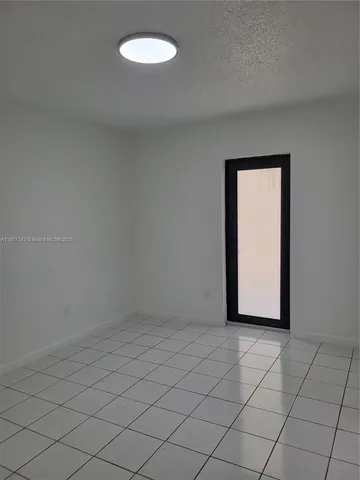 a white toilet and tub sitting next to a bathroom sink